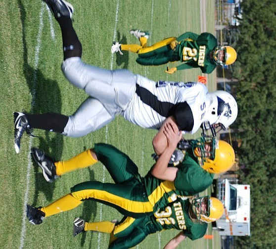 Tim Cranley II runs behind a block by a fellow Tiger.