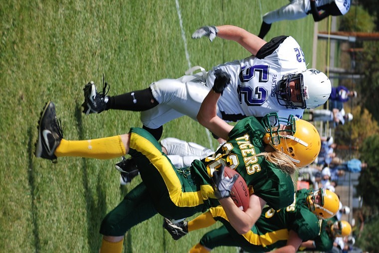 Tim Cranley II evades a Panther's linebacker during the football game Saturday afternoon.