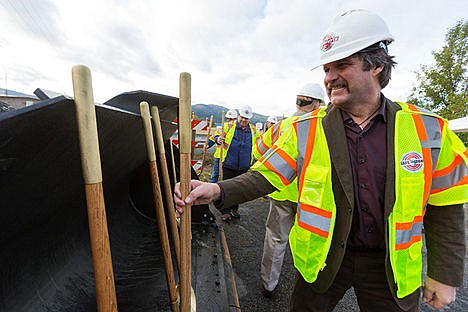 &lt;p&gt;Mike Worrall, with JUB Engineers, replaces a shovel he used during a groundbreaking ceremony on Greensferry Road.&lt;/p&gt;