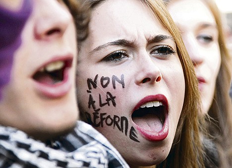 &lt;p&gt;A student shouts slogans during a demonstration in Paris, Thursday Oct.21, 2010. Protesters blockaded Marseille's airport, Lady Gaga canceled concerts in Paris and rioting youths attacked police in Lyon on ahead of a tense Senate vote on raising the retirement age to 62. A quarter of the nation's gas stations were out of fuel despite President Nicolas Sarkozy's orders to force open depots barricaded by striking workers. On her cheek reads: No to the reform.&lt;/p&gt;