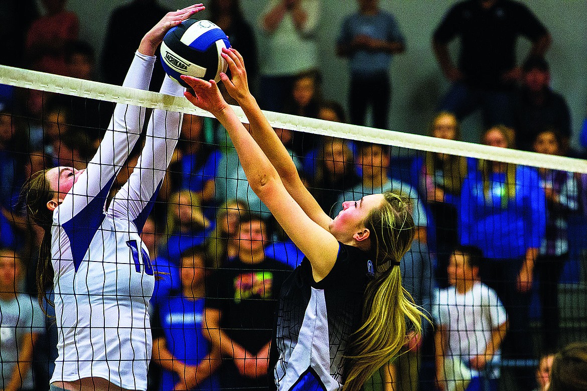 &lt;p&gt;TESS FREEMAN/Press&lt;/p&gt;&lt;p&gt;Coeur d&#146;Alene middle blocker Delaney Schmidt attempts to block a spike from Lewiston player Brett Hastings in the 5A district championship game in Coeur d&#146;Alene on Tuesday night. The Coeur d&#146;Alene Vikings beat the Lewiston Bengals 3-1.&lt;/p&gt;