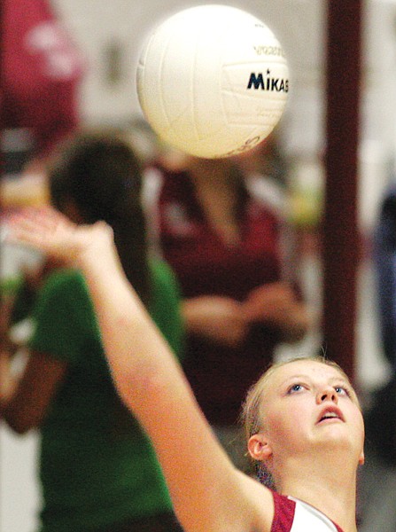 Troy's Holli Higgins serves during Tuesday night's third game vs. Bigfork.