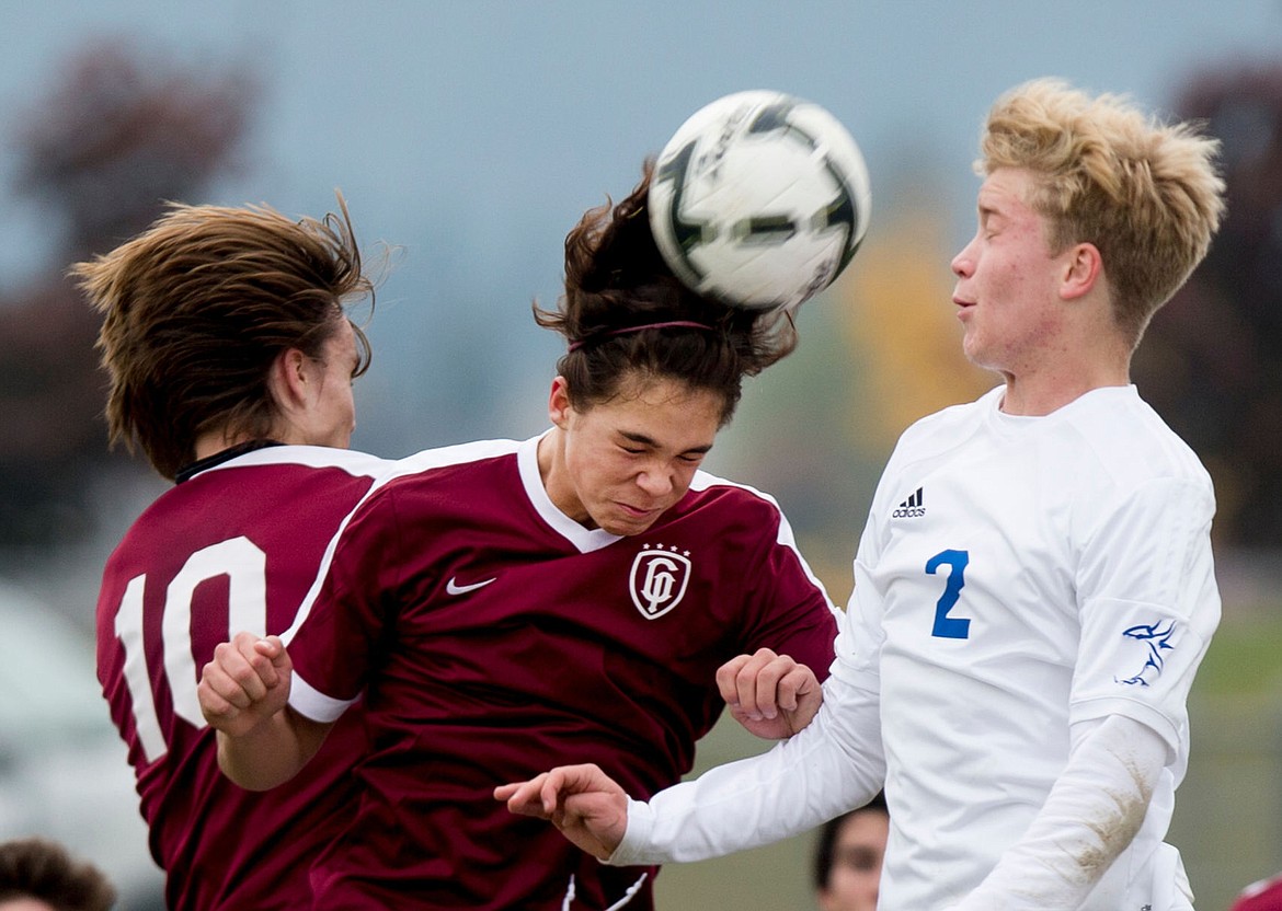 &lt;p&gt;JAKE PARRISH/Press Centennial's Erik Vaage (19) and Dempsey Brewer (2) of Coeur d'Alene battle for a header on Friday at Post Falls High School.&lt;/p&gt;