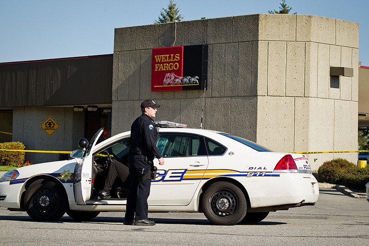 &lt;p&gt;Officer Baker with the Rathdrum Police Department works the scene of an armed bank robbery at that occurred shortly after 11:30 a.m. Thursday at Wells Fargo in Rathdrum. The gunman fled the scene in a late model hatchback, silver in color, with an undisclosed amount of cash.&lt;/p&gt;