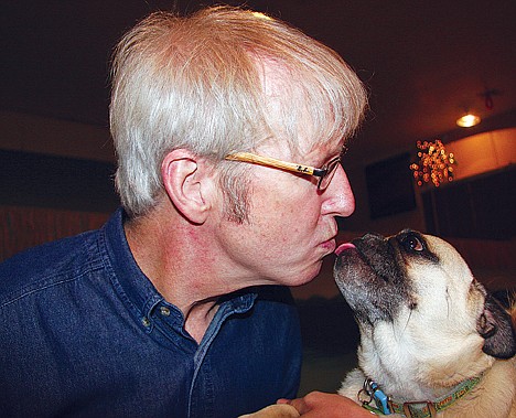 &lt;p&gt;Marty Becker, known as &quot;America's Veterinarian&quot; and from Bonners Ferry, gives attention to his daughter Mikkel's pug Bruce during the Dogtoberfest fundraiser for the Kootenai Humane Society on Saturday at the Coeur d'Alene Pet Resort.&lt;/p&gt;