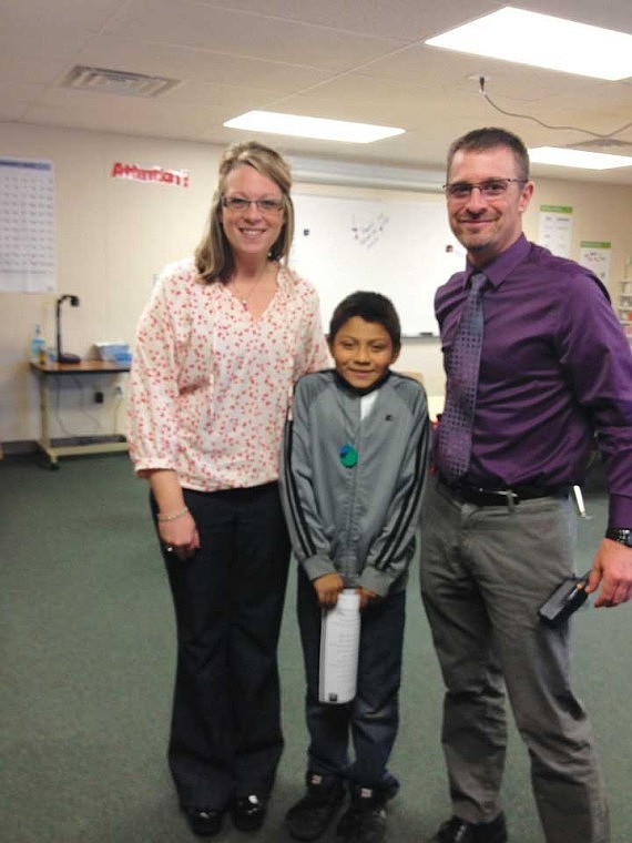 Bryan Moreno Alvarez received the principal's award at Red Rock Elementary School on Oct. 11 for improved attendance, effort and attitude. He is in Mrs. Zeilenga's 3rd grade homeroom class, but he was nominated for this award by Red Rock teacher Mrs. Covey, pictured with Bryan and Assistant Principal Rich Gregoire.