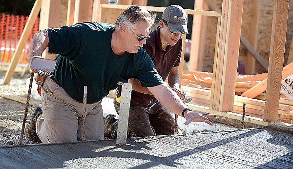 &lt;p&gt;FVCC instructor Greg Waldrop gives advice to Austin Stevens as he works on the sidewalk for the addition to Olney-Bissell School.&lt;/p&gt;