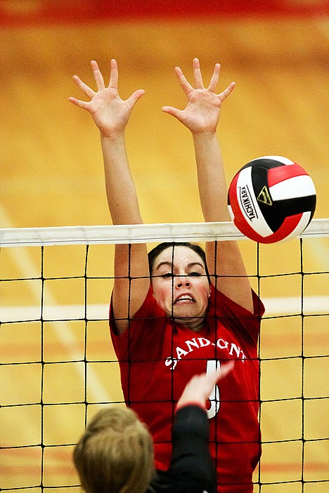 &lt;p&gt;Sandpoint sophomore middle blocker Halley Olin rises up during the Bulldogs' four-set win over Moscow in the 4A Region 1 championship game.&lt;/p&gt;