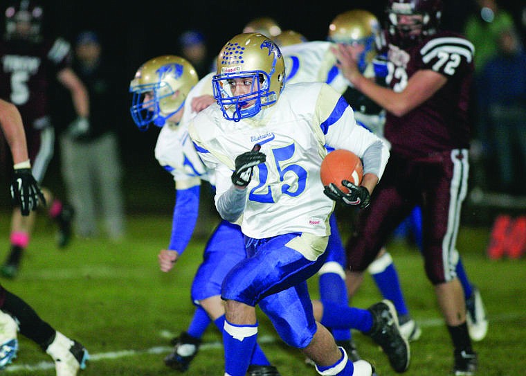 &lt;p&gt;Senior Nate Norris carries the ball in the first quarter against Troy. Thompson Falls would lose the game 12-42 despite their good effort.&lt;/p&gt;