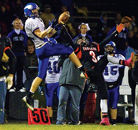 &lt;p&gt;Coeur d'Alene High's Jake Matheson goes up for a catch at the 50-yard line only to have it broken up by Damon Gonzalez from Post Falls during the second half of Friday's game.&lt;/p&gt;