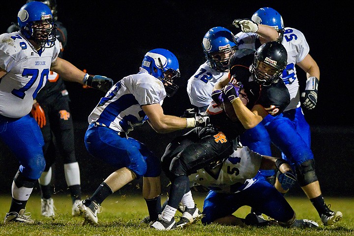 &lt;p&gt;Post Falls High's Tyson Johnson tries to spin for additional yardage as the Coeur d'Alene Viking defense closes in to end the play Friday.&lt;/p&gt;