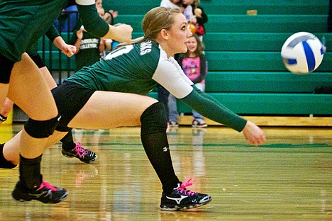 &lt;p&gt;Kristina Halvorsen from St. Maries High stretches for a dig following a Priest River High serve.&lt;/p&gt;