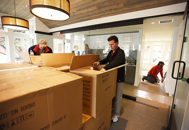 &lt;p&gt;Volunteers Bill Phillips, right, and Craig Mackey unload boxes of chairs in the new training center at the Clear Choice Clinic on Friday, Oct. 21, in Kalispell.&lt;/p&gt;