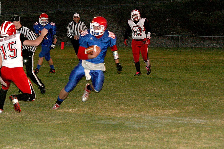 &lt;p&gt;Junior Wyatt Zylawy uses fancy footwork to get around the Noxon defender. Zylawy would complete two touchdown passes in the Bobcats' victory&lt;/p&gt;