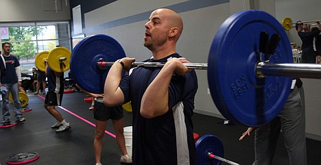 &lt;p&gt;Josh Schneider, a Spokane Valley resident and officer with the Coeur d&Otilde;Alene Police Department, lifts 115 pounds at a breast cancer fundraiser on Saturday.&lt;/p&gt;