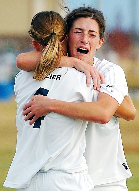 Maddey Frey embraces teammate Sydney Sharaf after Sharaf scored the game winning goal in the last minute of the overtime period on Frey's pass.