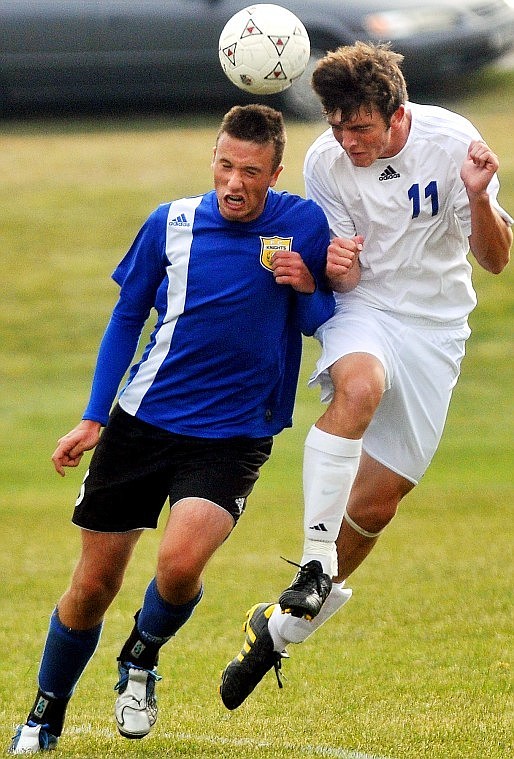 Stillwater Christian School's Cody Harmon (11) goes for a header against Yellowstone County Christian Home School's Eric Flanagan during the MCAA state championship match on Saturday.