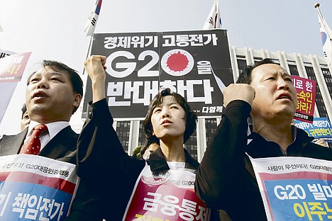 &lt;p&gt;South Korean protesters shout slogans during a rally against the G-20 Finance Ministers and Central Bank Governors Meeting in front of the government complex in Seoul, South Korea, Thursday. The meeting was held through Friday in Gyeongju. The letters at the top read &quot;Oppose G-20.&quot;&lt;/p&gt;