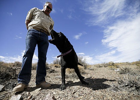 &lt;p&gt;Paul Dotsie gets a look and a bark from his dog Buster near Bishop, Calif. In his younger days, Buster would lay down on a spot like this to indicate an &quot;alert.&quot; But having lost a leg to cancer, the 12-year-old canine now prefers to poke his nose in the direction of a particular spot.&lt;/p&gt;