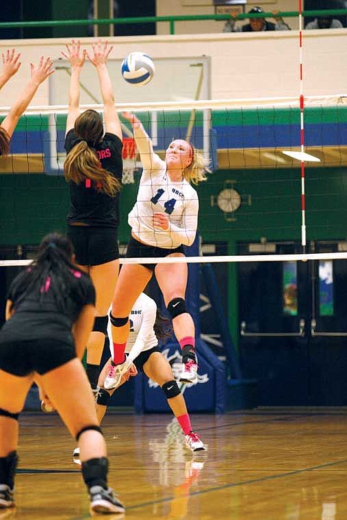 Big Bend sophomore outside hitter Shania Bateman sends a kill shot past Walla Walla defenders Wednesday, Oct. 22, at DeVries Activity Center.