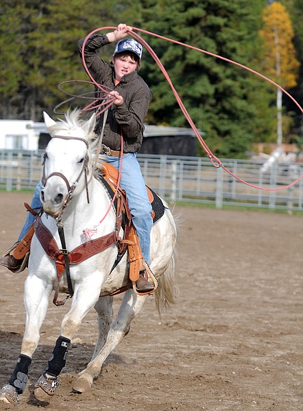 <p>Lincoln May practices roping on Streak, his Quarter Horse, on
Wednesday afternoon, in Ferndale.</p>