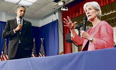 &lt;p&gt;President Barack Obama listens as Health and Human Services Secretary Kathleen Sebelius speaks June 8 in Wheaton, Md. Health insurers flirted with Democrats, supported them with money and got what they wanted: a federal mandate that most Americans carry health insurance coverage.&lt;/p&gt;