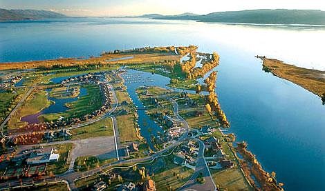 Despite increases in shoreline development, Flathead Lake continues to be one of the cleanest lakes in the temperate region, according to researchers at the Flathead Lake Biological Station. This aerial view shows the Eagle Bend development on the left, flanked by the Flathead River to the right. Karen Nichols/Daily Inter Lake