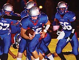Cats drop Loggers, secure playoff berth