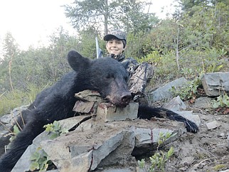 &lt;p&gt;Ridge Lovett, 13, Post Falls, shot his first bear recently in the St. Joe wildness area at 464 yards. He was hunting with his dad Lonnie Lovett and family friend Randy McEnespy.&lt;/p&gt;