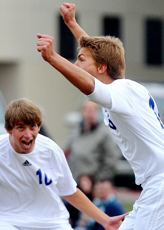 Stillwater Christian School's Joshua LeGassey (right) and Justin Kauffman celebrate the team's sixth goal scored in the first half of Saturdays Montana Christian Athletic Association state championship match at Stillwater Christian.