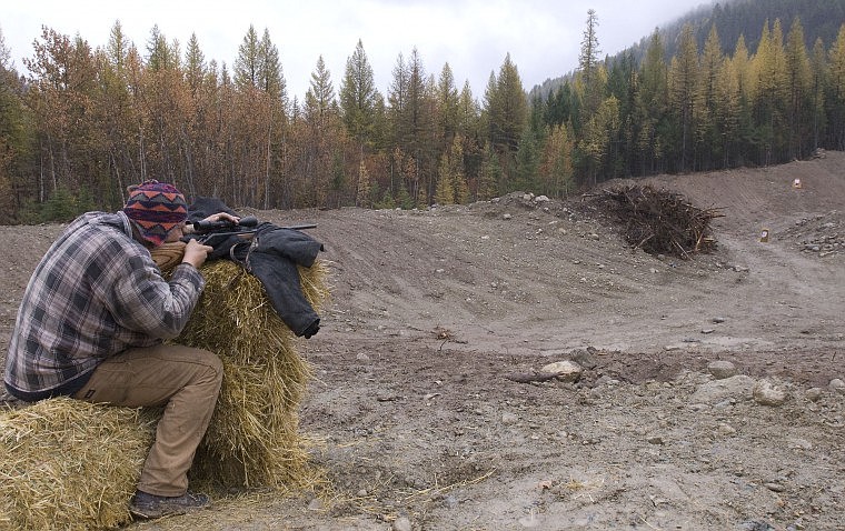 In preparation for Sunday&#146;s start of the general hunting season, Riley Sumner of Kalispell aims at the farthest target, 100 yards, with his .25-06 rifle about 5 miles from Tally Lake on Friday afternoon.