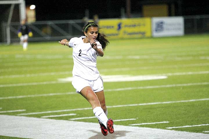 Junior defender Emma Deering (2) fires a ball downfield.