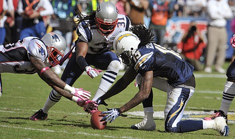 &lt;p&gt;San Diego Chargers wide receiver Richard Goodman, right, drops the ball as New England safety Brandon Meriweather, center, and cornerback Devin McCourty, left, dive for it in the second half of Sunday's game in San Diego. The Patriots won 23-20.&lt;/p&gt;