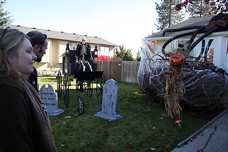 &lt;p&gt;Becky Albrecht and Joe Hollingsworth take in the Halloween display on their lawn at 1004 Starling Ave. in Hayden.&lt;/p&gt;