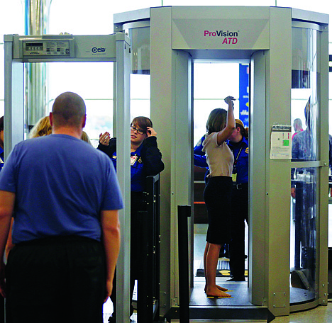 &lt;p&gt;Passengers are scanned at a Terminal C security checkpoint at Logan Airport in Boston using a millimeter wave body scanner, which produces a cartoon-like outline rather than naked images of passengers produced by a similar machine using X-rays. The Transportation Security Administration is deploying more of the millimeter wave machines at seven major U.S. airports where the agency is removing all of the full-body X-ray scanners that have been criticized by privacy advocates.&lt;/p&gt;