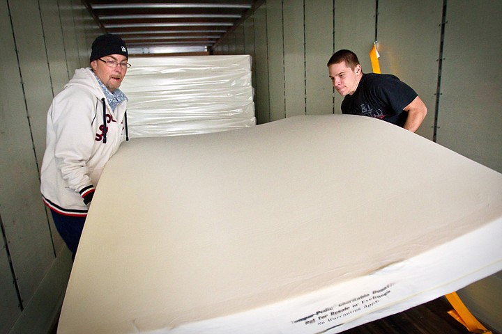 &lt;p&gt;Jeremy Rejniak, right, and Philip Rich, manager of the Sandman Transitional Housing for St. Vincent de Paul, carry one of the 10 new mattresses that were donated by Tempur-Pedic to replace the 15 and 20-year-old mattresses at the housing complex.&lt;/p&gt;