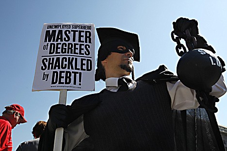 &lt;p&gt;HOLD FOR RELEASE UNTIL 12:01 A.M. EDT WEDNESDAY, OCT. 26. THIS PHOTO MAY NOT BE PUBLISHED, BROADCAST OR POSTED ONLINE BEFORE 12:01 A.M. EDT. - In this Oct. 6, 2011 photo, Gan Golan, of Los Angeles, dressed as the &quot;Master of Degrees,&quot; holds a ball and chain representing his college loan debt, during Occupy DC activities in Washington. As President Obama prepared to announce new measures Wednesday to help ease the burden of student loan debt, new figures painted a demoralizing picture of college costs for students and parents: Average in-state tuition and fees at four-year public colleges rose an additional $631 this fall, or 8.3 percent, compared with a year ago. (AP Photo/Jacquelyn Martin)&lt;/p&gt;