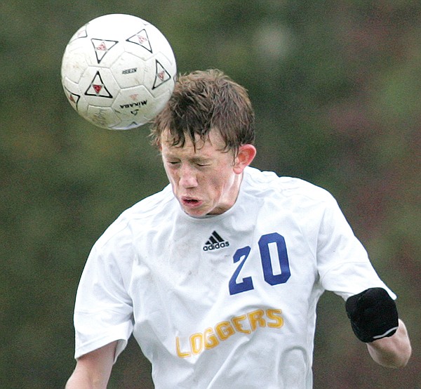 Libby's Cree Maloney advances the ball on a header against Livingston in the state semifinals.