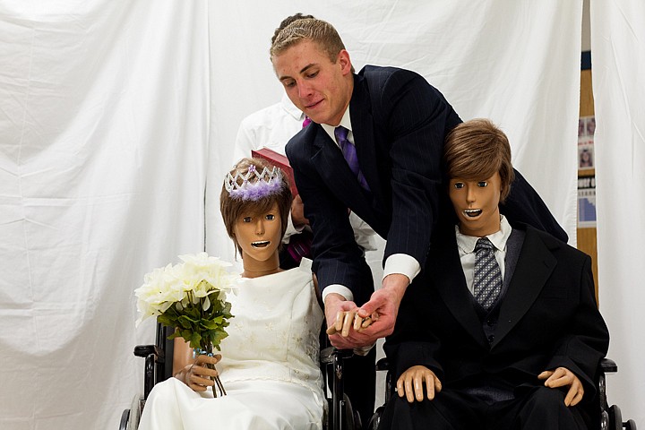 &lt;p&gt;SHAWN GUST/Press Brinton Taylor, a senior at Lake City High School, puts a ring on the dummy bride during a mock wedding Tuesday in his health occupations class at Coeur d'Alene High School. The program, a Kootenai Technical Education Campus venture with the local high schools, put on the wedding using the training dummies as a way to raise funds for this year's Health Occupations Students Association state competition.&lt;/p&gt;