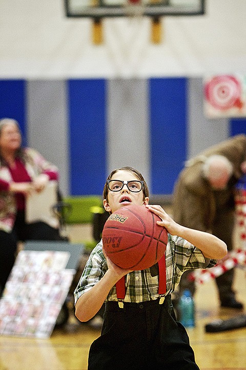 &lt;p&gt;JEROME A. POLLOS/Press Devin Perry, 10, practices his basketball skills while wearing his &quot;nerdy&quot; costume Friday at Ponderosa Elementary's Harvest Carnival in Post Falls.&lt;/p&gt;