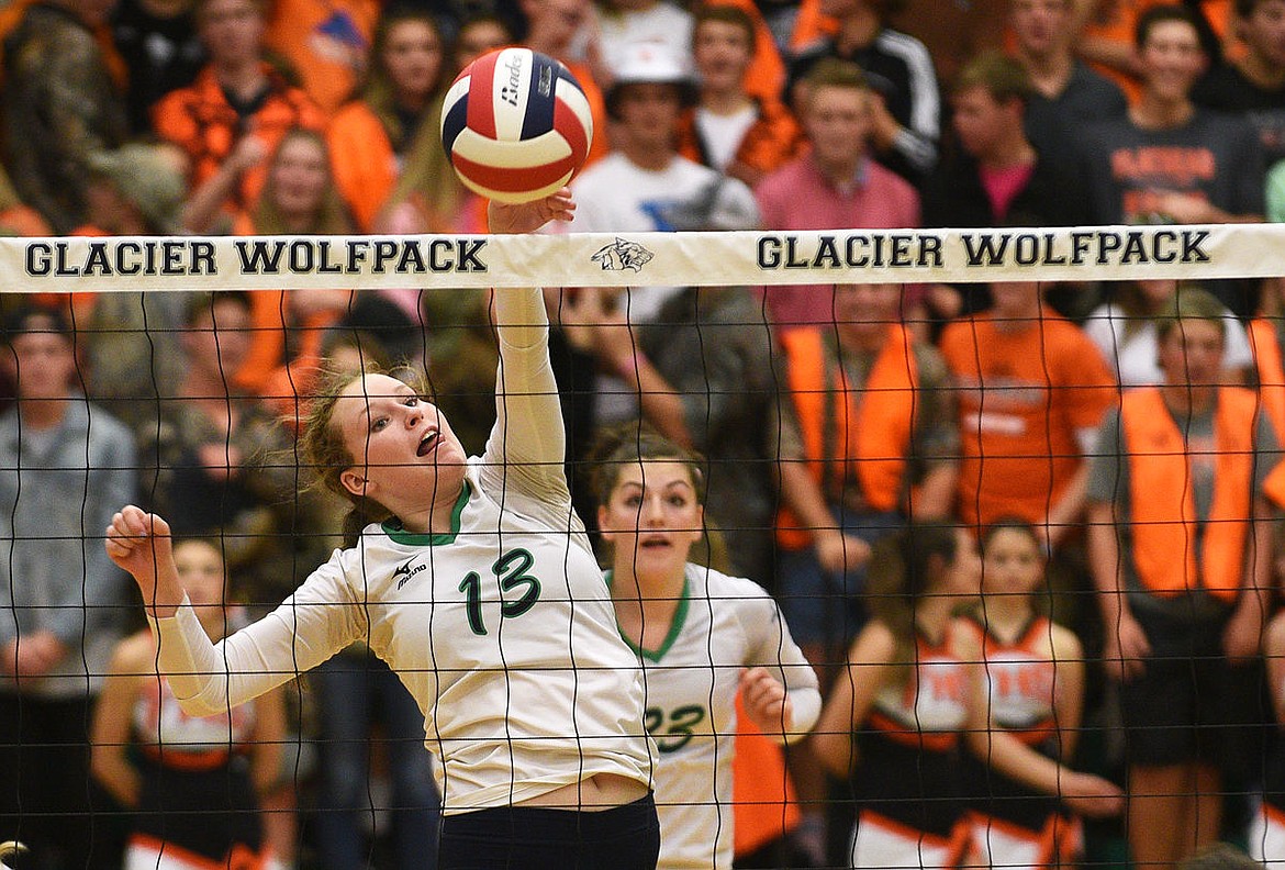 &lt;p&gt;Glacier middle hitter Meagan Gillespie tips the ball for a point during the second game of their 3-game sweep at Glacier on Thursday. (Aaric Bryan/Daily Inter Lake)&lt;/p&gt;