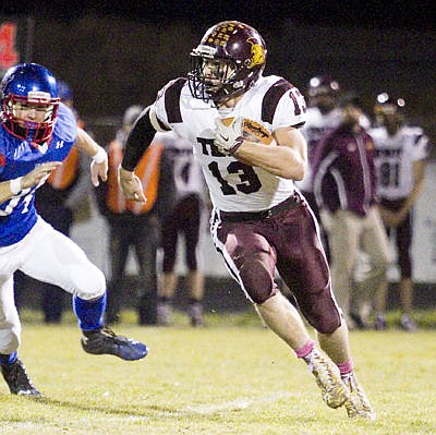 &lt;p&gt;Sally Finneran/Bigfork Eagle Troy's Sean Opland runs the ball against Bigfork on Friday. Opland had the only touchdown for the Trojans.&lt;/p&gt;
