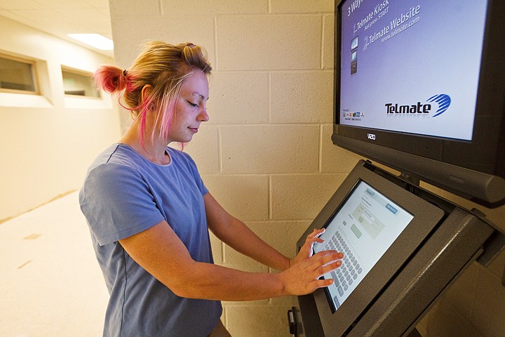 &lt;p&gt;SHAWN GUST/Press Alexandria Hobbick uses a kiosk at the Kootenai County jail to set up a visitation with her fiancee.&lt;/p&gt;