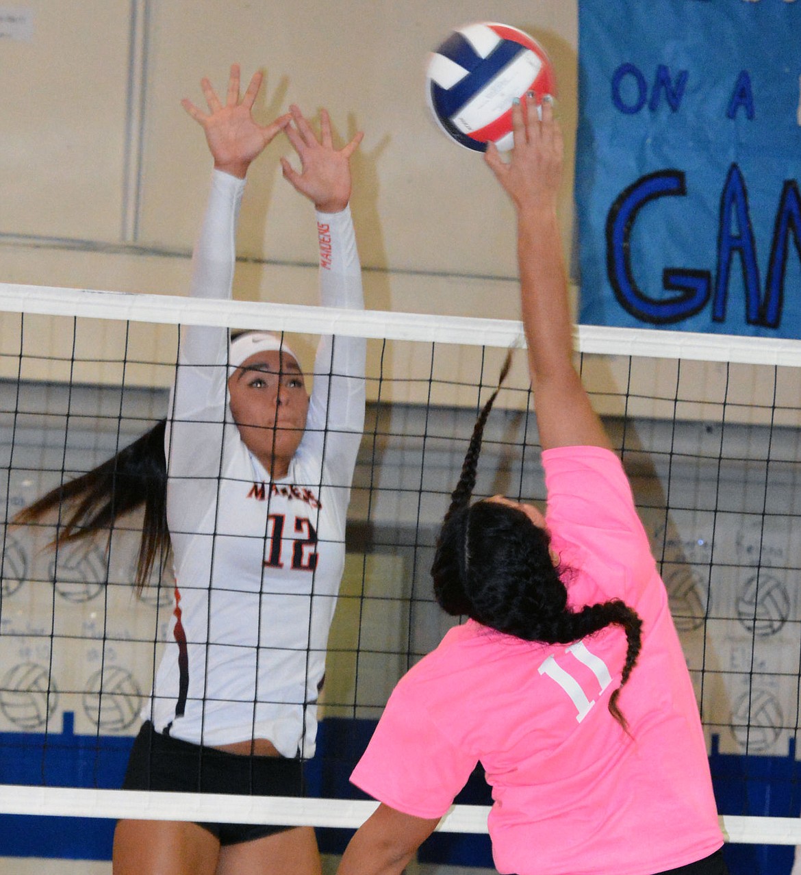 &lt;p&gt;RONAN HIGH School player &lt;strong&gt;Lee Camel&lt;/strong&gt; attempts to block a Mission High School volleyball players attempt at a kill attempt by &lt;strong&gt;Addison Arlint&lt;/strong&gt; in Thursday's regular-season match at Mission High School.&lt;/p&gt;