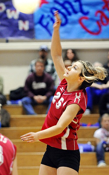 Columbia Falls senior Jonna Werner (25) hits the ball over the net in the first match against Libby on Tuesday night. Libby won the match up 25 to 13.