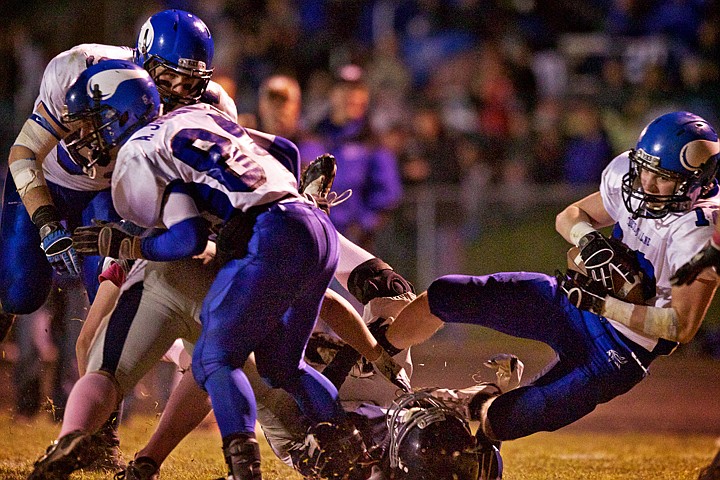 &lt;p&gt;JEROME A. POLLOS/Press Coeur d'Alene High's Joe Roletto crashes over a Lake City player at the end of his 41-yard catch-and-run to put the Viking's in a first and goal from the four-yard line during the second half of the Viking's 62-21 win Thursday over Lake City.&lt;/p&gt;