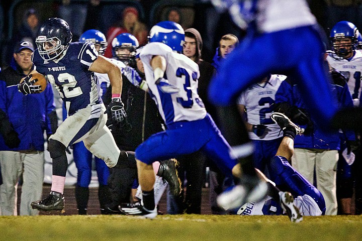 &lt;p&gt;JEROME A. POLLOS/Press Lake City High's Danny Brum sprints past the Coeur d'Alene defense on his way to end zone during his 85-yard touchdown run.&lt;/p&gt;