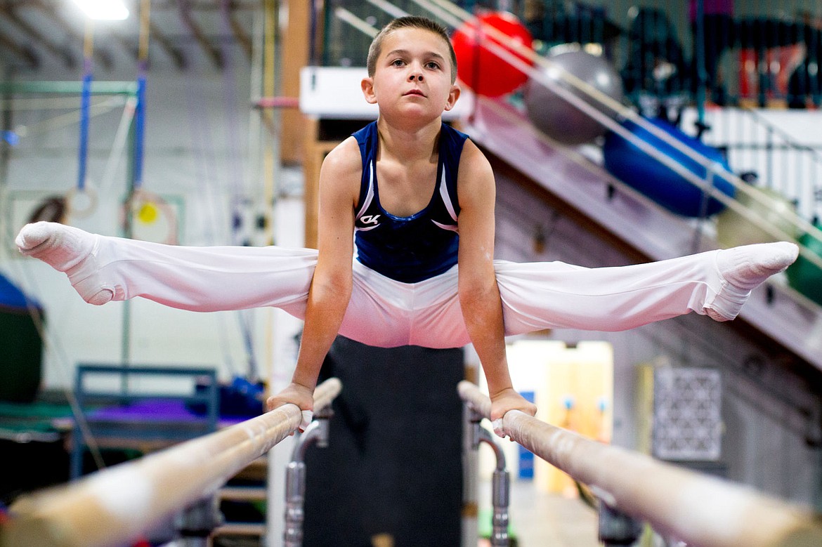 &lt;p&gt;JAKE PARRISH/Press Caden Severtson, 12, balances on parallel bars during a practice session on Oct. 24, 2016 at his gym, Avant Coeur Gymnastics.&lt;/p&gt;