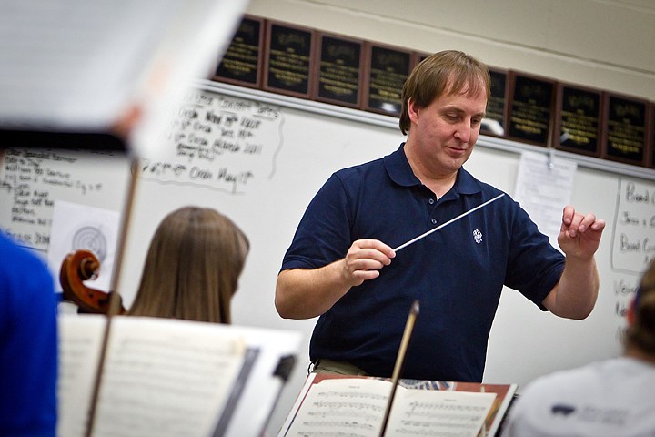 &lt;p&gt;Tim Sandford, the Lake City High School instrumental director, provides the pacing Tuesday for the orchestra rehearsing &quot;A Night in Paris&quot; during run-through for Friday's concert at the Kroc Center.&lt;/p&gt;