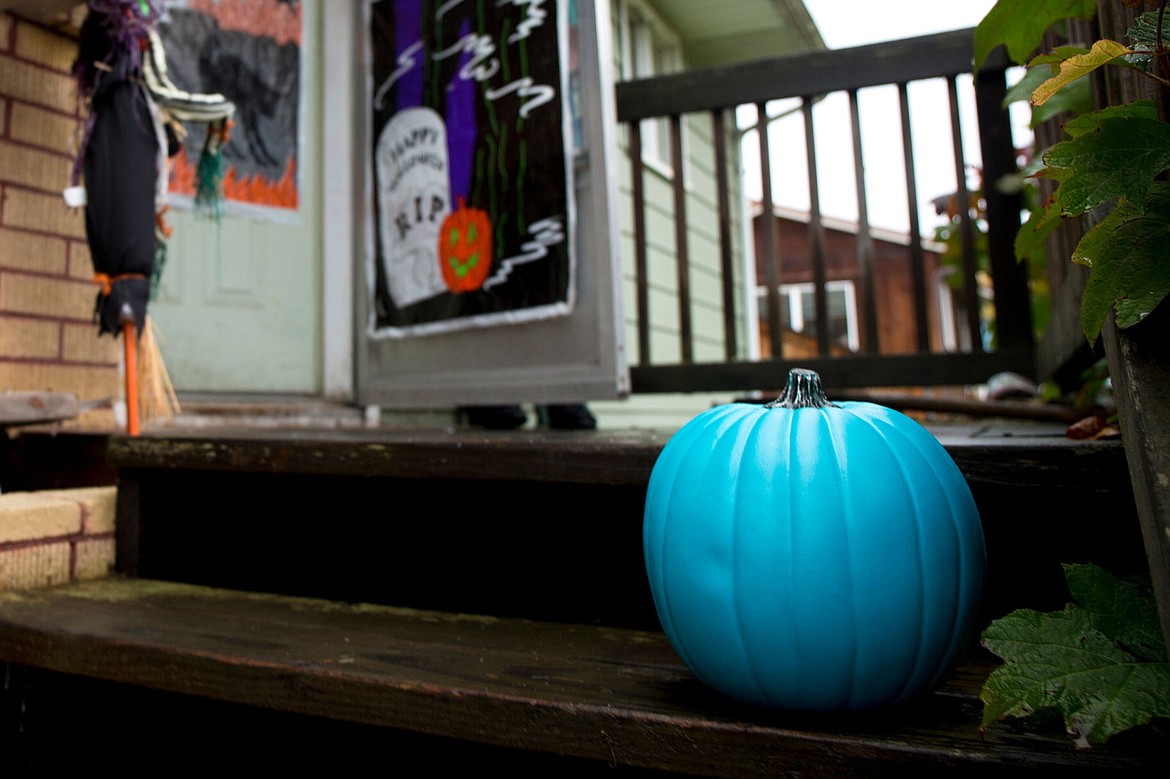 &lt;p&gt;A teal-colored pumpkin sits on the porch of a home on Mill Avenue on Thursday. The pumpkin notifies trick-or-treaters they can receive allergen-free treats there.&lt;/p&gt;